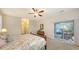 Bright bedroom with sliding glass doors and an antique dresser at 5068 Inshore Landing Dr, Apollo Beach, FL 33572