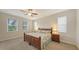 The bedroom features a decorative bed frame flanked by two windows on either side at 5068 Inshore Landing Dr, Apollo Beach, FL 33572