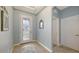 Bright foyer with decorative glass door, tile flooring, and high ceilings, creating an inviting entrance at 5068 Inshore Landing Dr, Apollo Beach, FL 33572