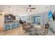 Open-concept living area with modern kitchen, dining space, and access to a screened lanai at 5068 Inshore Landing Dr, Apollo Beach, FL 33572