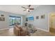 Comfortable living room with neutral tones, a cozy sofa, and a screened lanai at 5068 Inshore Landing Dr, Apollo Beach, FL 33572