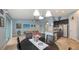 An open-concept living space seamlessly connects the dining, kitchen, and living room areas at 5068 Inshore Landing Dr, Apollo Beach, FL 33572