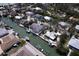 An aerial view of homes along the canal, complete with private boat docks, near ocean, and waterfront living at 552 Juan Anasco Drive, Longboat Key, FL 34228