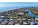High angle aerial showing houses nestled among waterways and white sandy beaches at 552 Juan Anasco Drive, Longboat Key, FL 34228