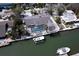 Aerial view of home featuring a private pool, boat dock, and direct access to the canal at 552 Juan Anasco Drive, Longboat Key, FL 34228