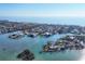 Overhead view of luxury waterfront homes on serene canals, set against a picturesque ocean backdrop at 552 Juan Anasco Drive, Longboat Key, FL 34228