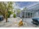 Relaxing backyard with a screened lanai, refreshing pool, and decorative stone pathway at 552 Juan Anasco Drive, Longboat Key, FL 34228