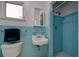 A retro bathroom featuring blue tile and classic fixtures, creating a charming vintage appeal at 552 Juan Anasco Drive, Longboat Key, FL 34228