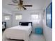 This cozy bedroom is well-lit with natural light coming through the windows at 552 Juan Anasco Drive, Longboat Key, FL 34228