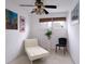 Small white bedroom features a daybed, chair and artistic wall decor at 552 Juan Anasco Drive, Longboat Key, FL 34228