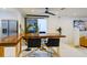 Open concept dining area with stylish bar seating, seamless integration to the living room, and ample lighting at 552 Juan Anasco Drive, Longboat Key, FL 34228