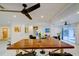 Spacious dining area features an oversized table and sliding glass doors to the outdoors at 552 Juan Anasco Drive, Longboat Key, FL 34228