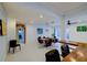 Bright dining area with modern lighting is adjacent to the patio and outdoor pool at 552 Juan Anasco Drive, Longboat Key, FL 34228