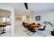 Bright dining area featuring a modern chandelier, spacious layout, and seamless transition to the living area at 552 Juan Anasco Drive, Longboat Key, FL 34228