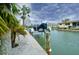 Exterior shot of a private dock on a canal, providing easy access to boating and waterfront activities at 552 Juan Anasco Drive, Longboat Key, FL 34228