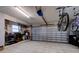 This large garage has tile floors, work bench, and storage with a motorized door at 552 Juan Anasco Drive, Longboat Key, FL 34228