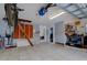 Spacious garage features tile flooring, ample storage space, and organization solutions at 552 Juan Anasco Drive, Longboat Key, FL 34228