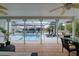Relaxing lanai with a refreshing pool overlooking a canal, perfect for outdoor enjoyment at 552 Juan Anasco Drive, Longboat Key, FL 34228