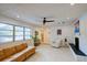 Bright living room featuring a large sectional sofa, neutral walls, recessed lighting, and large windows at 552 Juan Anasco Drive, Longboat Key, FL 34228