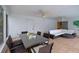 Spacious patio with dining table, ceiling fans, and a comfortable seating area at 552 Juan Anasco Drive, Longboat Key, FL 34228