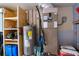 Well-organized utility room featuring a water heater, HVAC system, and ample storage shelving at 552 Juan Anasco Drive, Longboat Key, FL 34228