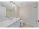 Neutral bathroom featuring a shower-tub, single sink vanity, and updated lighting at 5601 Bentgrass Dr # 10-115, Sarasota, FL 34235