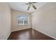 Cozy bedroom with a ceiling fan and a large window providing natural light at 5601 Bentgrass Dr # 10-115, Sarasota, FL 34235