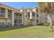 Attractive exterior showing screened lanais and well-maintained landscaping at 5601 Bentgrass Dr # 10-115, Sarasota, FL 34235