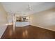 Bright living room features an open floorplan leading to a modern kitchen with stainless steel appliances at 5601 Bentgrass Dr # 10-115, Sarasota, FL 34235