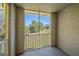Screened patio with a view of landscaping and community buildings in the distance at 5601 Bentgrass Dr # 10-115, Sarasota, FL 34235