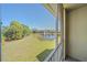 Relaxing patio view overlooking a serene pond with a fountain and lush greenery at 5601 Bentgrass Dr # 10-115, Sarasota, FL 34235