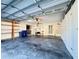Spacious garage with built-in shelving and ample storage space at 5638 Garden Lakes Palm, Bradenton, FL 34203