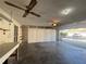Open garage featuring multiple storage options and workbench area at 5638 Garden Lakes Palm, Bradenton, FL 34203