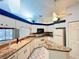 Bright kitchen boasts white cabinets, an island, and laminate countertops at 5638 Garden Lakes Palm, Bradenton, FL 34203