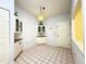 Bright kitchen nook with tiled floor, built-in cabinets, and a window at 5638 Garden Lakes Palm, Bradenton, FL 34203