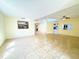 Spacious living room with tile floors, ample natural light, and neutral wall paint at 5638 Garden Lakes Palm, Bradenton, FL 34203