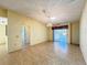 Open-concept living room with tile floors, and sliding glass doors leading to lanai at 5638 Garden Lakes Palm, Bradenton, FL 34203
