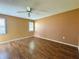 Cozy bedroom with wood-look flooring, and bright windows at 5638 Garden Lakes Palm, Bradenton, FL 34203