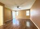 Large bedroom with wood floors, two windows, and a sliding glass door to outside at 5638 Garden Lakes Palm, Bradenton, FL 34203