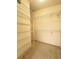 Spacious walk-in closet with multiple rows of shelves and beige carpet at 5638 Garden Lakes Palm, Bradenton, FL 34203