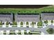 Aerial view of townhomes showcasing landscaping, parking and streetscape at 5734 Archipelago St, Nokomis, FL 34275