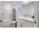 Well-lit bathroom with tub and a shower combo and single sink vanity at 5734 Archipelago St, Nokomis, FL 34275