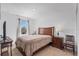 Bright bedroom features wood furnishings and natural light at 5734 Archipelago St, Nokomis, FL 34275