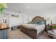 Spacious bedroom featuring neutral decor, a large window, and stylish, comfortable furniture at 5734 Archipelago St, Nokomis, FL 34275