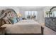 Comfortable bedroom features a large window and tasteful decor at 5734 Archipelago St, Nokomis, FL 34275