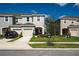 Charming townhomes featuring neutral color schemes, attached garages, and well-maintained landscaping at 5734 Archipelago St, Nokomis, FL 34275