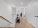Upstairs hallway with neutral carpeting, modern lighting, and access to multiple rooms at 5734 Archipelago St, Nokomis, FL 34275