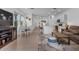 Spacious open-concept with natural light that seamlessly connects the kitchen, dining, and living areas at 5734 Archipelago St, Nokomis, FL 34275