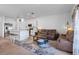 Inviting living space flowing into the kitchen area, showcasing an open-concept layout and ample lighting at 5734 Archipelago St, Nokomis, FL 34275