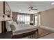 Relaxing bedroom features a queen bed, with ensuite bathroom and beach view at 5757 Gulf Of Mexico Dr # 110, Longboat Key, FL 34228